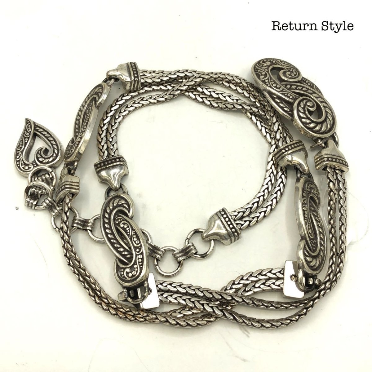 https://returnstyle.com/cdn/shop/products/brighton-silvertone-chain-belt-183562_1200x.jpg?v=1641913572
